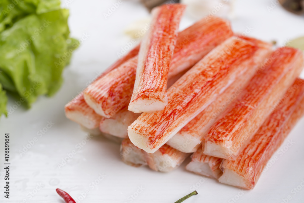 Red crab stick with green lettuce and coriander, pepper and other spices. Red crab stick with green lettuce and coriander, pepper and other spices.