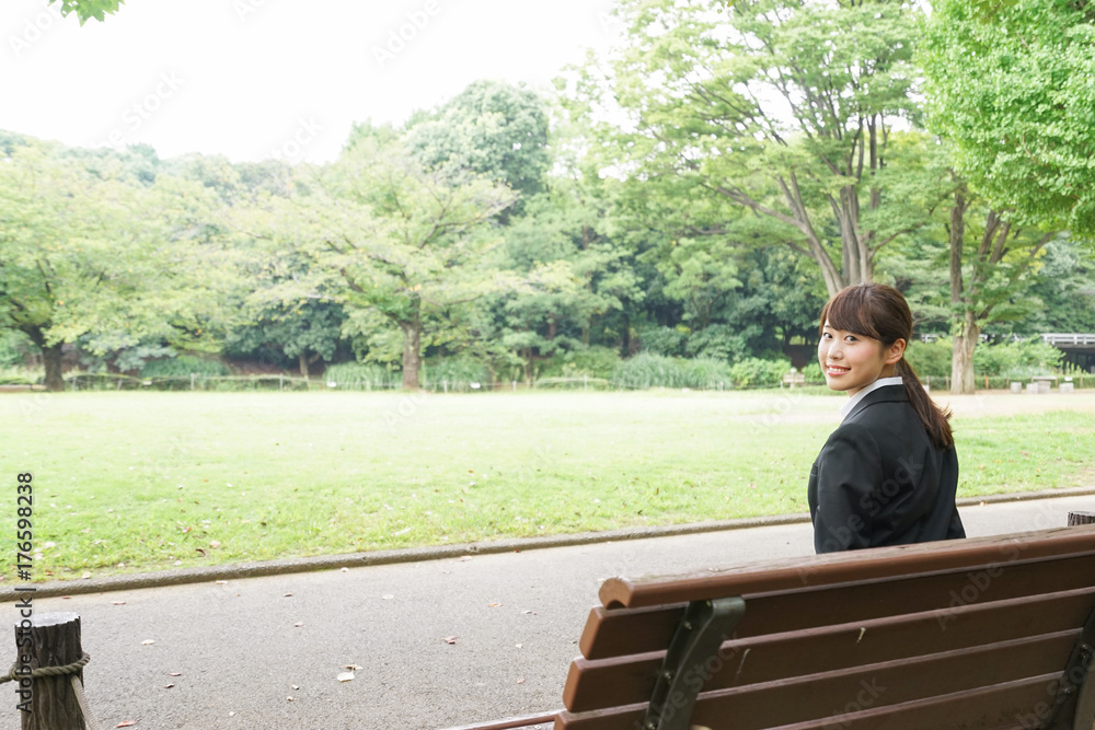 Fototapeta premium Business woman sitting on the bench