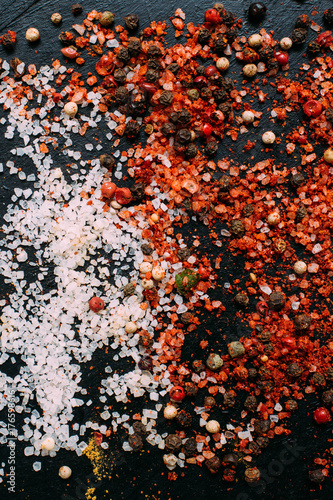 food spice salt pepper paprika dark background concept