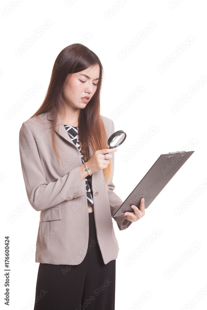Young Asian woman with a magnifying glass check report. Young Asian woman with a magnifying glass check report.