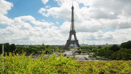 Eiffel Tower video from Trocadero Place with flowers on foreground. Right to left slow panning. photo