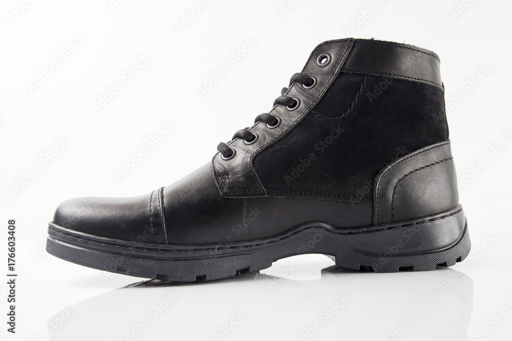 Male black leather boot on white background, isolated product. Male black leather boot on white background, isolated product.