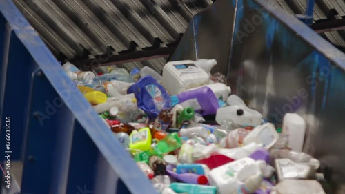 Plastic recycling container shredder waste crusher. Pet bottle ready for recycling in a garbage sorting center.