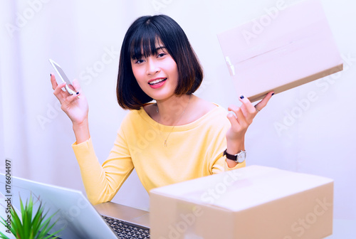 beautiful woman owner in delivery startup service Postal box, express mail, package