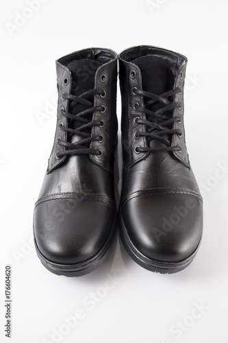 Male black leather boot on white background, isolated product.