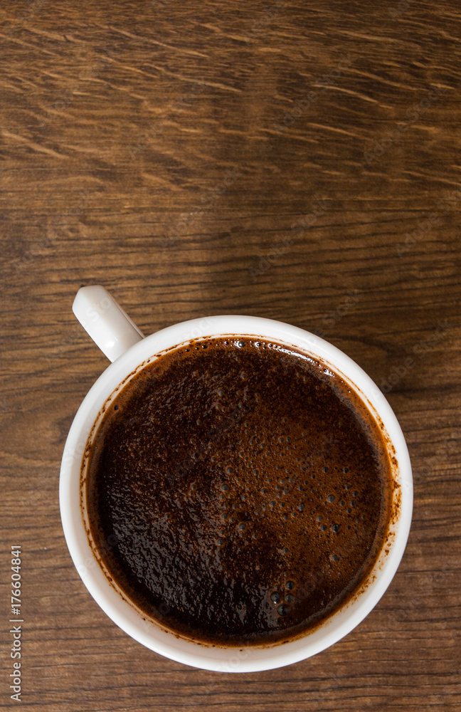 Cup of hot espresso coffee on wood table. top view. with copy space. Cup of hot espresso coffee on wood table. top view. with copy space.