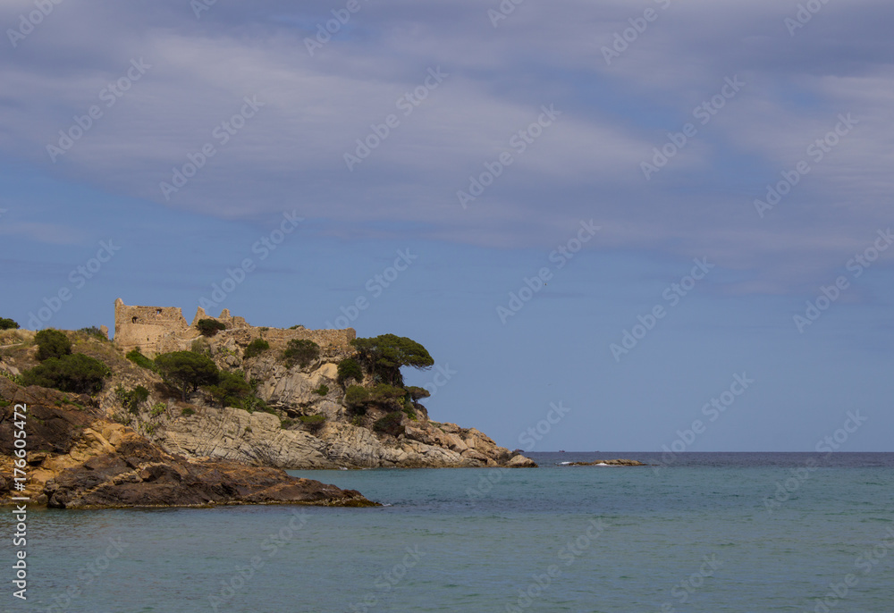 Island in the sea with an ancient ruined fortress, Spain, Catalonia