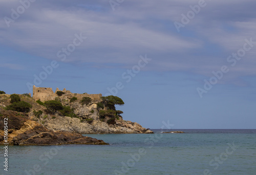 Island in the sea with an ancient ruined fortress, Spain, Catalonia