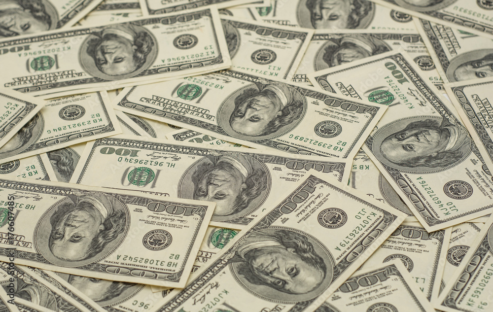 background of many hundred dollar bills background of many hundred dollar bills
