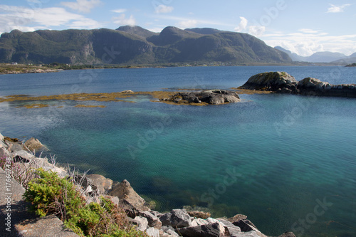 Turquoise water surrounded by mountains.