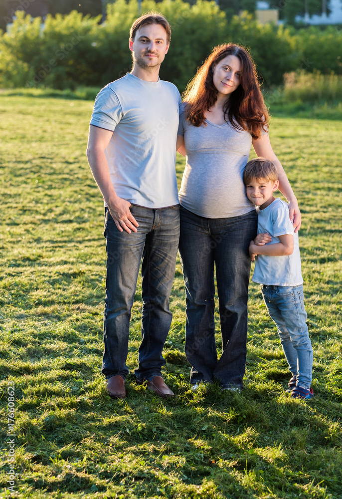 Happy pregnant family of three expecting new baby Happy pregnant family of three expecting new baby