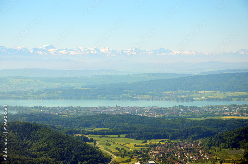 Aerial view of Lake Constance with Alps in background on a sunny summer day