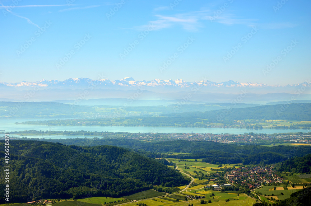 Aerial view of Lake Constance with Alps in background on a sunny summer day