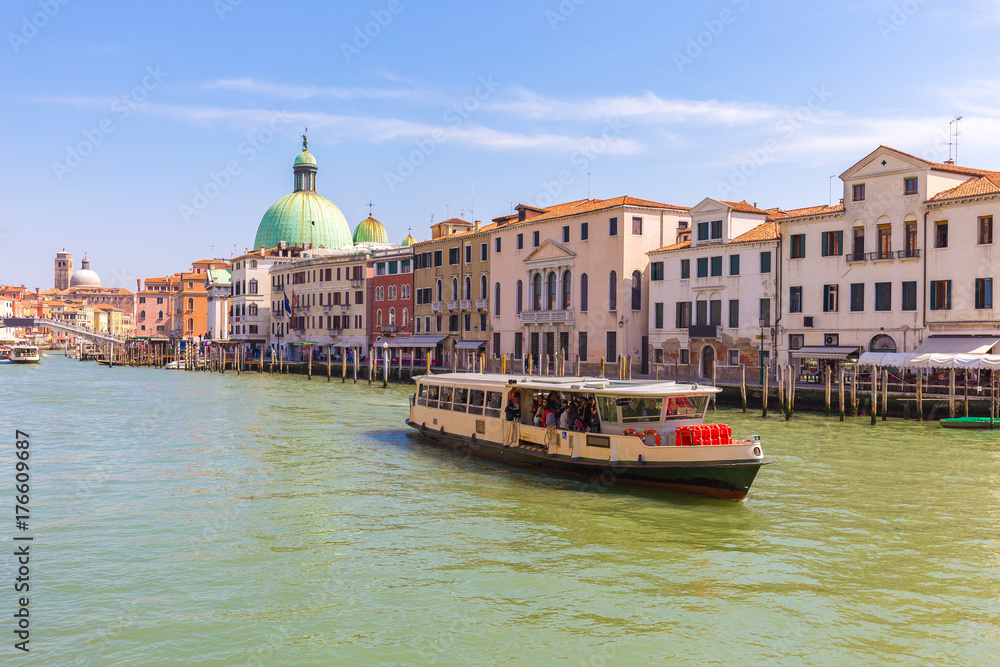 Fototapeta premium Water Bus and view of Venice city canal in Venice, Italy