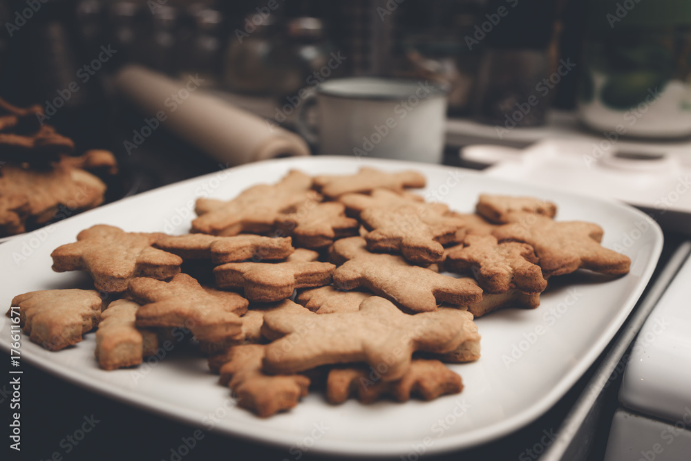 Gingerbread man cookies on the white plate Gingerbread man cookies on the white plate