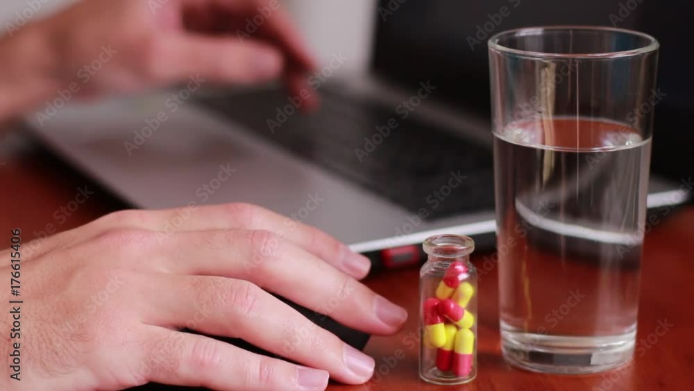Working with mouse and taking medicine Working with mouse and taking medicine