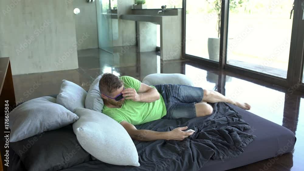 Man sleeping on bed and wakes up because of the received message
Man sleeping on bed and wakes up because of the received message
