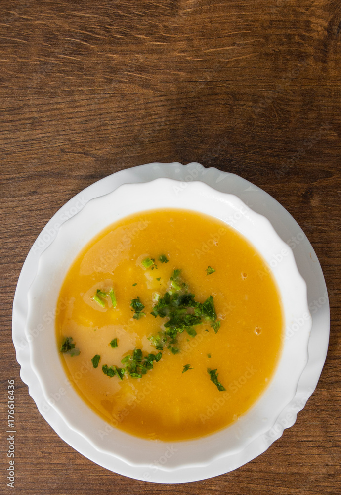 Vegetarian cream pea soup on a wooden background. with copy space. top view Vegetarian cream pea soup on a wooden background. with copy space. top view