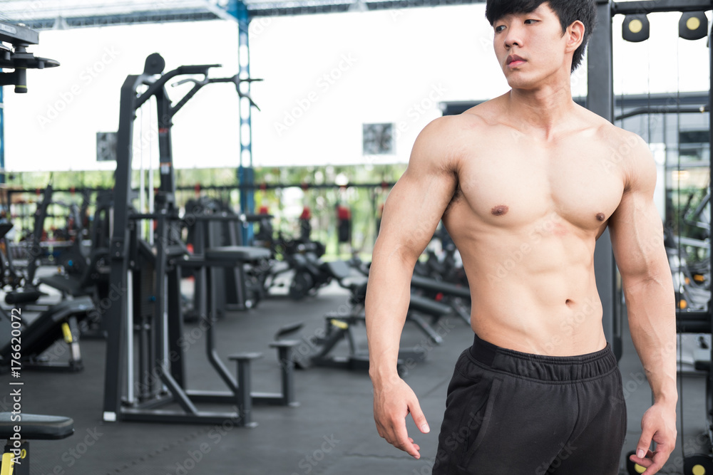 man athlete prepare for training in gym. bodybuilder male working out in fitness center. sport guy doing exercises in health club.