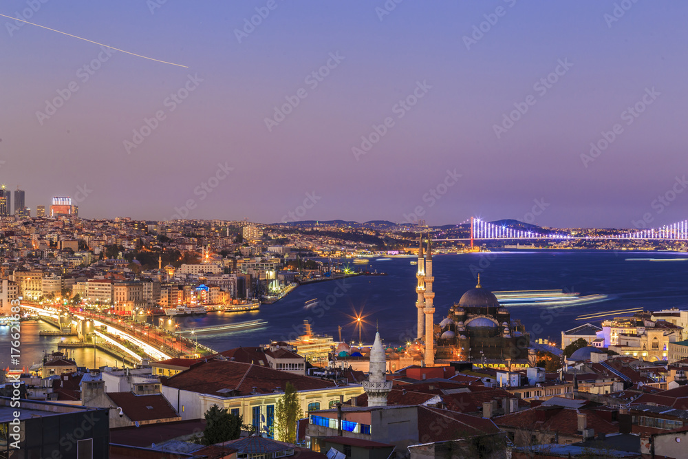 Istanbul view from down town of the city during the twilight with beatiful atmospheric blue sky and city lights