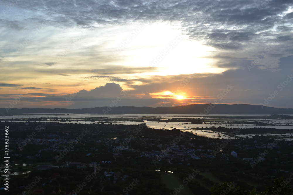 The view of the city in Myanmar during sunset as shot from Mandalay Hill