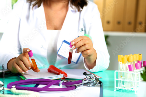 the wife of the doctor at the desk in the office