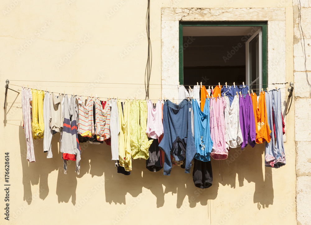 colorful clothes drying on line at Lisbon house