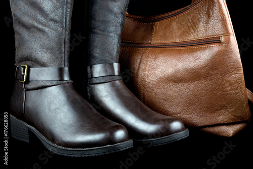 Leather Boots and Bag on Black Background