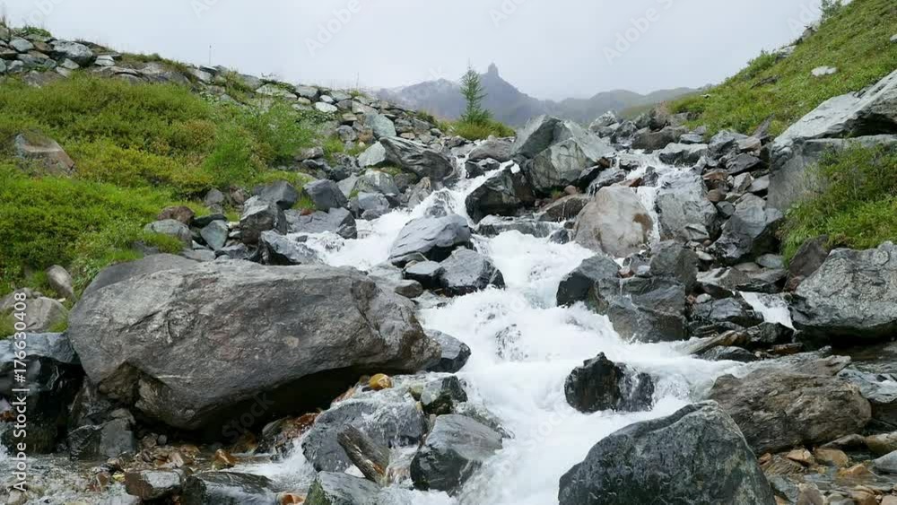 Beautiful small mountain waterfall in the Austrian alps near the Grossglockner Beautiful small mountain waterfall in the Austrian alps near the Grossglockner