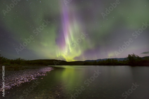 Aurora Borealis over the river. River Paypudyna. Polar Urals. Russia. © olenyok