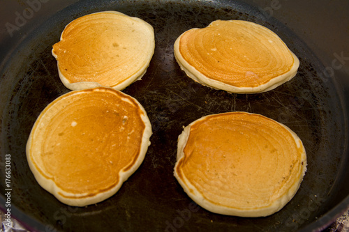 cooking four pancake on frying pan homemade