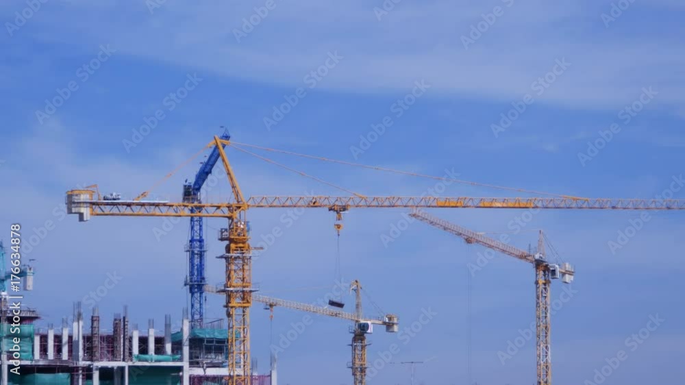 4k video of Crane moving construction panel with blue sky 4k video of Crane moving construction panel with blue sky