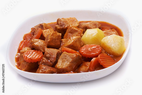 Goulash, beef stew with potatoes isolated on white background