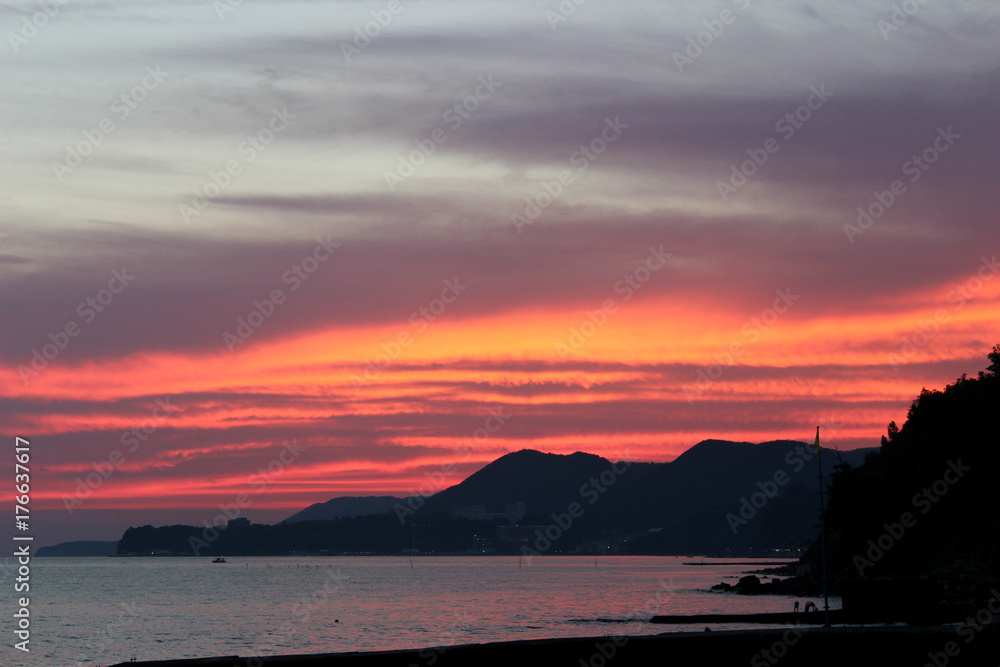 sunset on the sea, the sea and the mountains, pink sunset