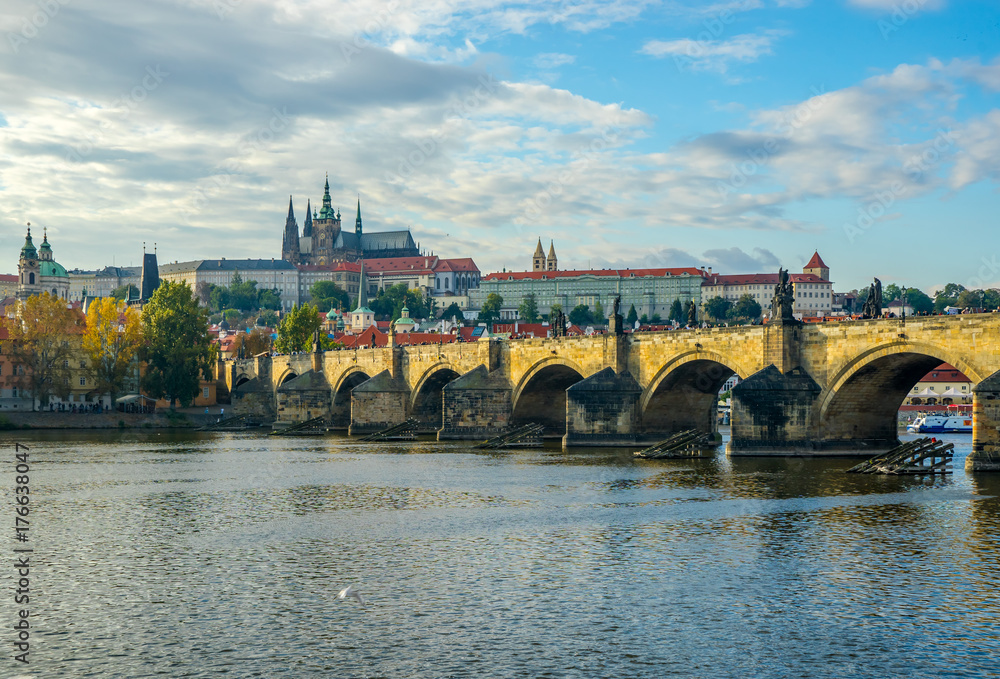 Obraz premium Prague Castle and Charles Bridge in Prague, in the Czech Republic at sunset. St. Vitus Cathedral. The Vltava River.