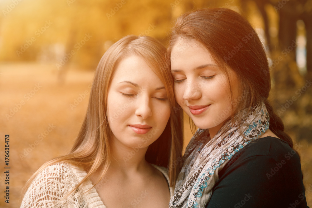 young females in autumn forest eyes closed