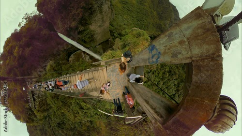 Experience the breathtaking beauty of Rio Verde,Ecuador with a panoramic view of the wooden rope bridge and Pailon del Diablo waterfall captured on October 01,2017.