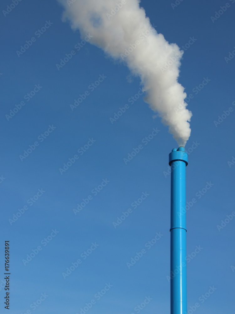 Blue Industrial Chimney on Sky Background with White Steam