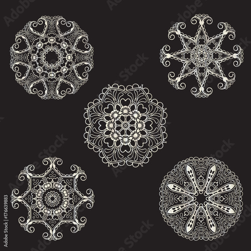 Collection of silver mandalas of 5 elements, design elements on a black background
