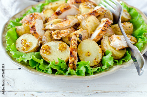 Warm salad of chicken and potatoes with mustard dressing