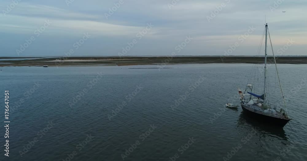 Dusk aerial seascape view of Olhao dockyard, waterfront to Ria Formosa natural park and Armona island. Algarve. Dusk aerial seascape view of Olhao dockyard, waterfront to Ria Formosa natural park and Armona island. Algarve.