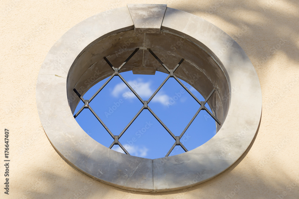 Obraz premium round window with grille