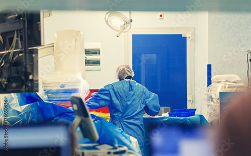 Interventional cardiologist doing percutaneous coronary intervention coronary angiography using a c-arm imaging system high-quality fluoroscopic angiograph photo