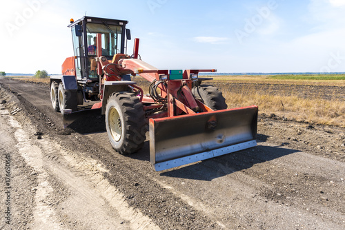 Grader for leveling roads