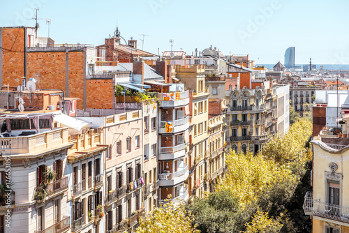 Photography Top view on residential buildings on the street in Barcelona city