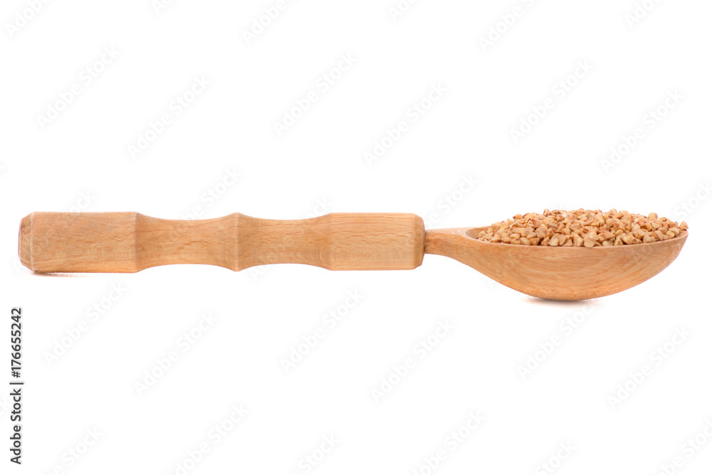 Wooden spoon with buckwheat isolated Wooden spoon with buckwheat isolated