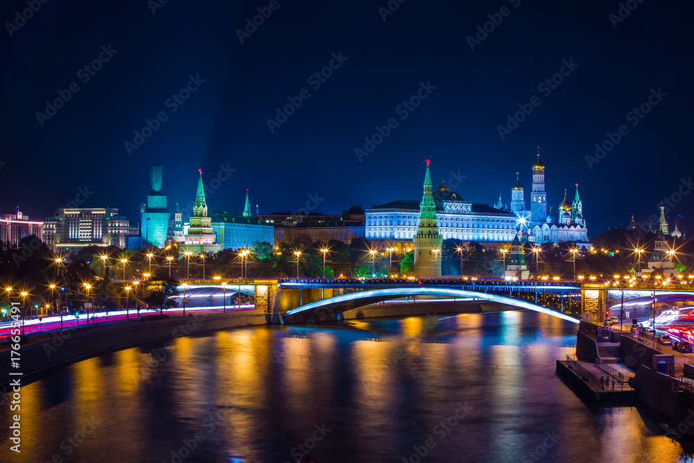 Classic Moscow night postcard, the Kremlin on the river bank in front of the bridge, Place for text. Big Stone Bridge, The Moscow Kremlin, Russia.