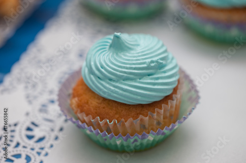 Closeup of blue cupcakes. Selective focus. Sweet dessert tasty food concept muffin baby shower treat. Sweettooth. Bakery