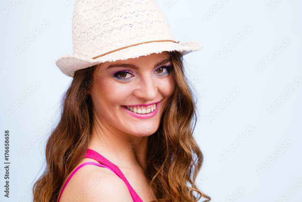 Woman in summer straw hat on head smiling Woman in summer straw hat on head smiling