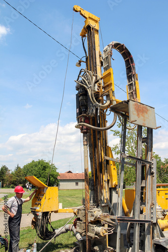 Worker Operates The Geothermal Drilling Machine